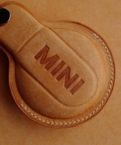 Hand-stitched Full Grain Leather Key Fob Covers for Mini Cooper. Personalize with names, logos, or phone numbers. Over 30 leather color choices.