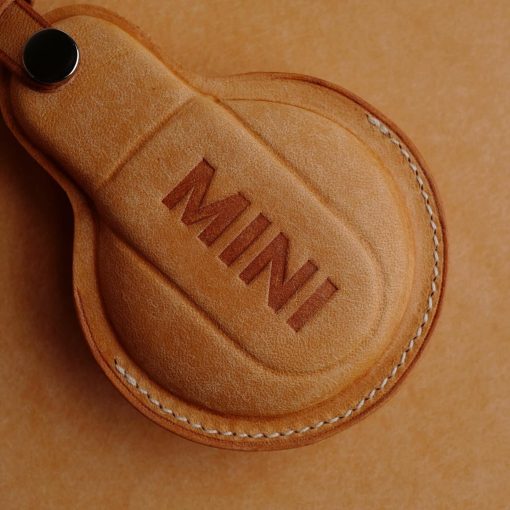 Hand-stitched Full Grain Leather Key Fob Covers for Mini Cooper. Personalize with names, logos, or phone numbers. Over 30 leather color choices.