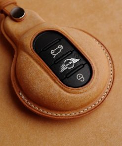 Hand-stitched Full Grain Leather Key Fob Covers for Mini Cooper. Personalize with names, logos, or phone numbers. Over 30 leather color choices.