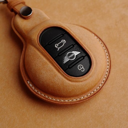 Hand-stitched Full Grain Leather Key Fob Covers for Mini Cooper. Personalize with names, logos, or phone numbers. Over 30 leather color choices.