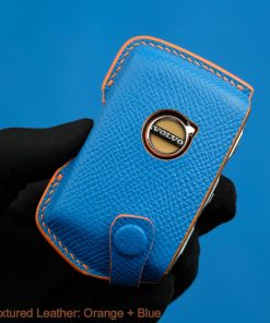 Elevate your Volvo driving experience with our handmade leather key fob cover. Choose from 30+ colors to match your style. Personalize with name, number, or logo.