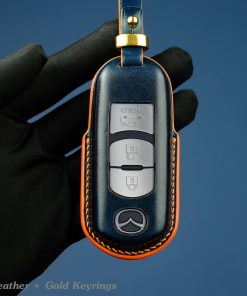 Customizable full-grain leather key fob case for Mazda with personalized embossing option in various colors, handmade by LeatherSwift.Com