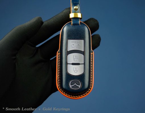 Customizable full-grain leather key fob case for Mazda with personalized embossing option in various colors, handmade by LeatherSwift.Com