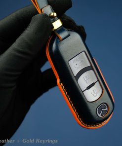 Customizable full-grain leather key fob case for Mazda with personalized embossing option in various colors, handmade by LeatherSwift.Com