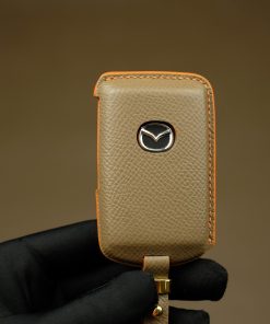 Mazda Series Customizable Leather Key Fob Case. Personalized full grain leather cover for your Mazda key fob with your choice of color, stamped initials or logo from LeatherSwift.com.