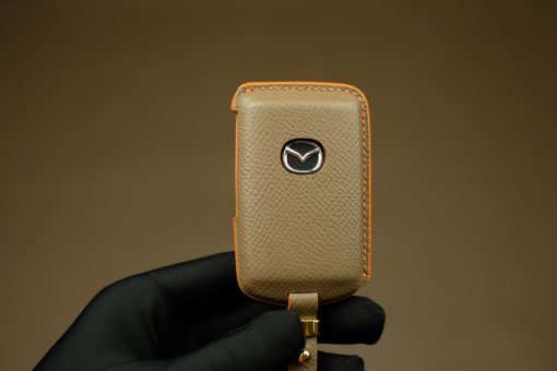 Mazda Series Customizable Leather Key Fob Case. Personalized full grain leather cover for your Mazda key fob with your choice of color, stamped initials or logo from LeatherSwift.com.